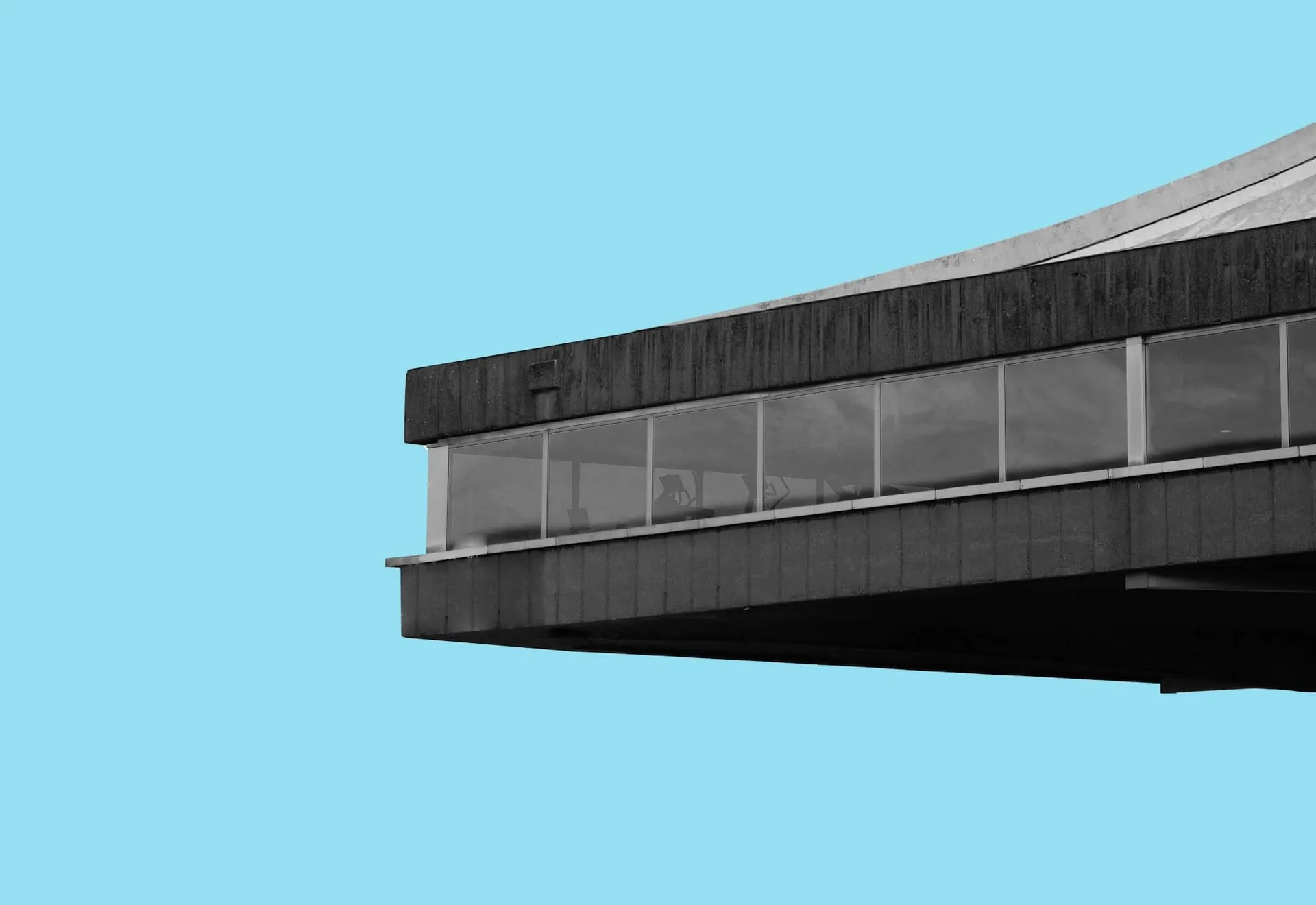 Brutalist concrete cantilever cyan backdrop