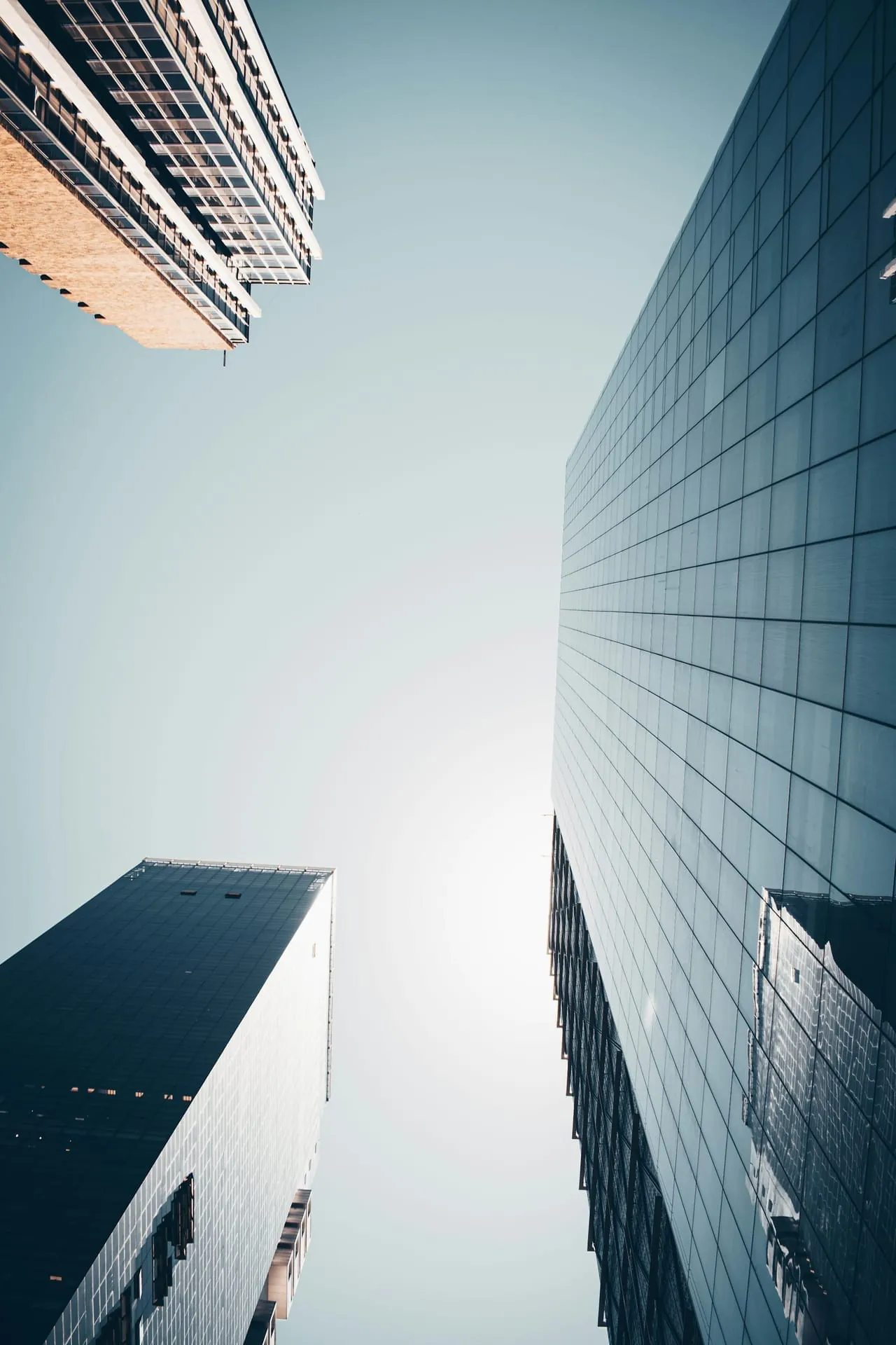 Glass skyscrapers upward urban canyon