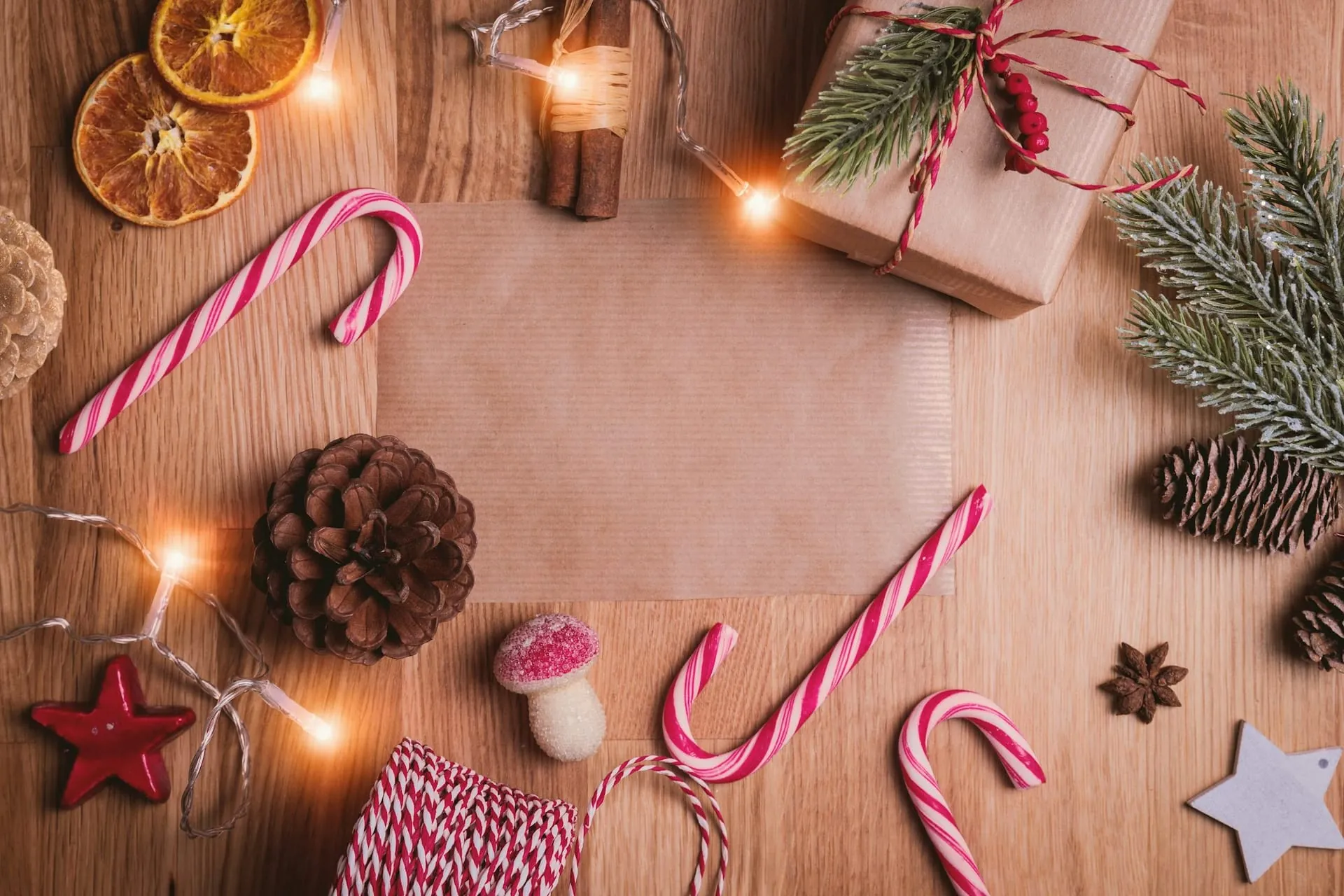 Christmas flatlay kraft card candy canes pinecones