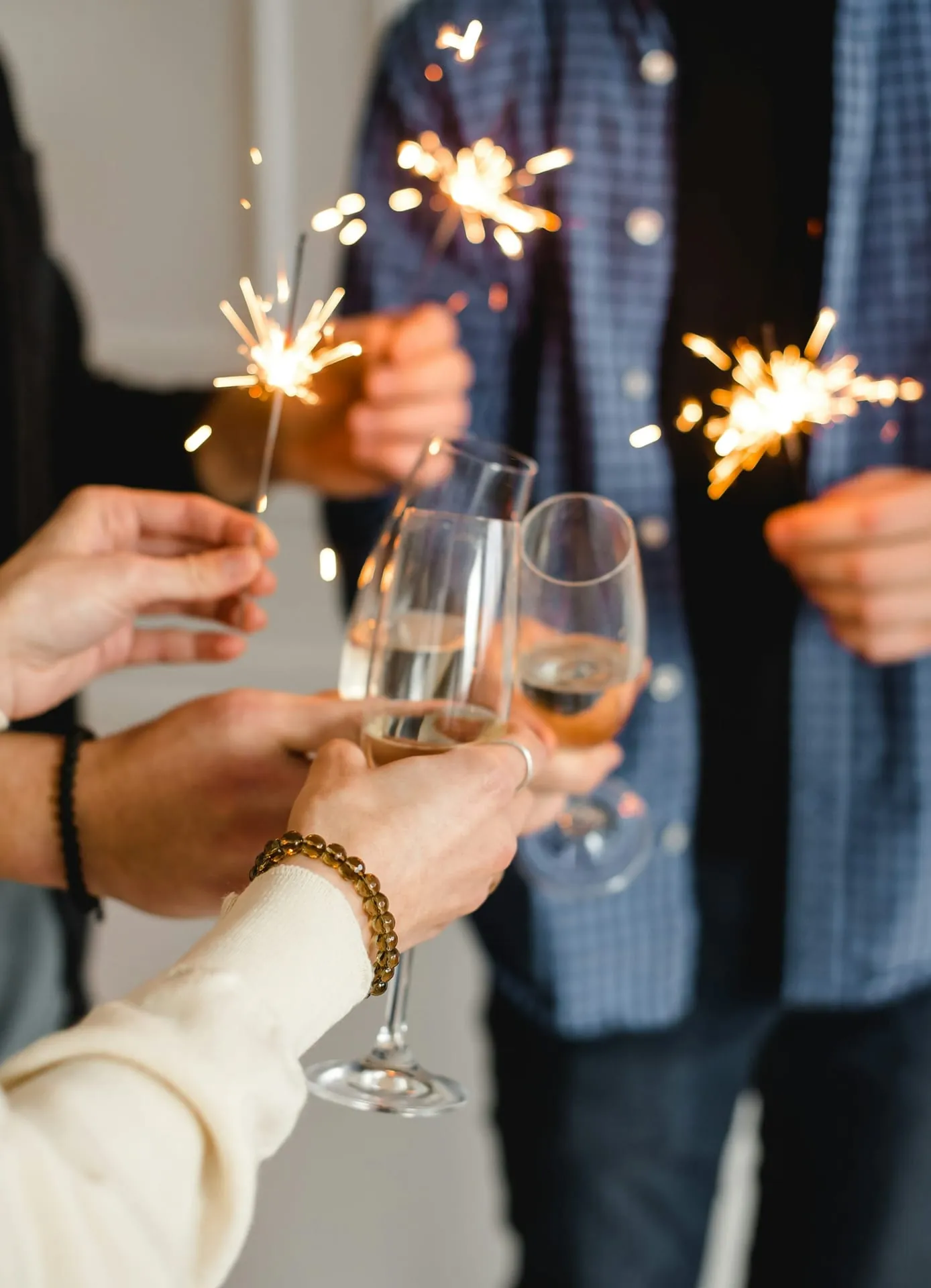 Hands sparklers champagne toast celebration