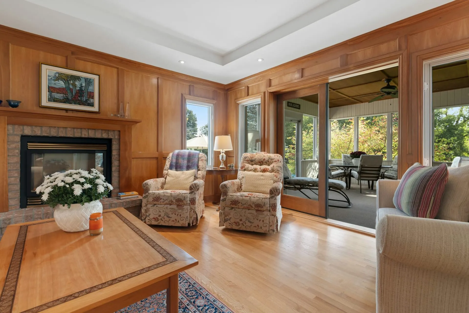 Real estate interior wood panelled living room brick